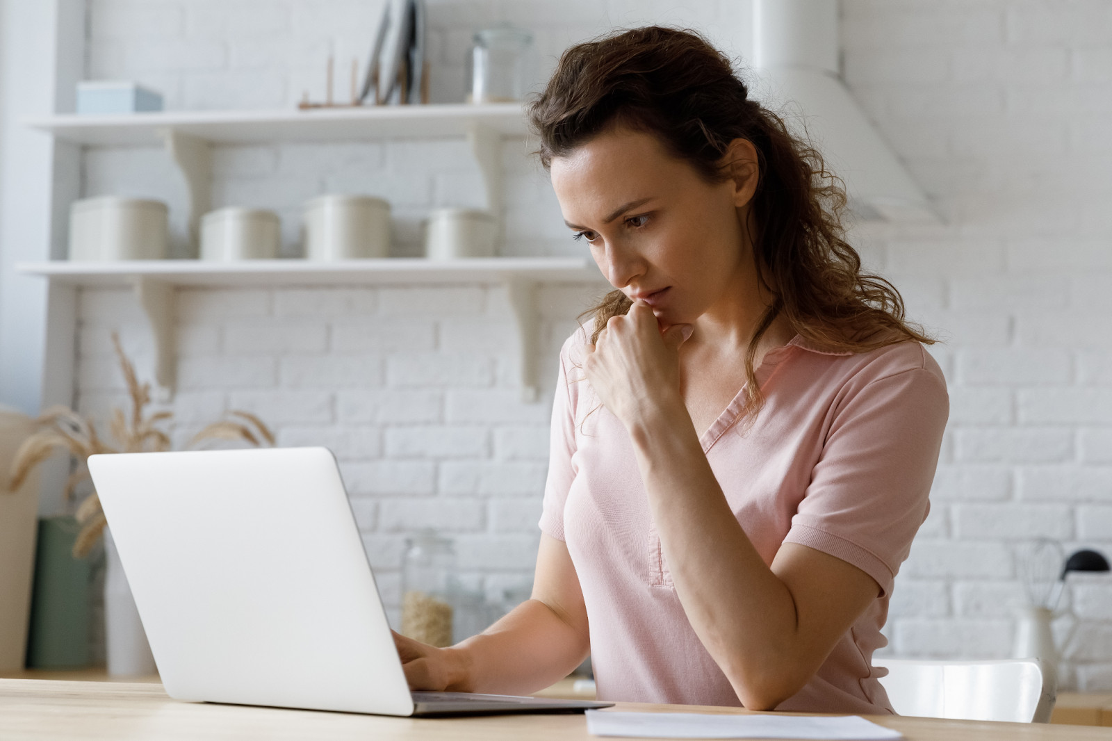 Woman looking at laptop